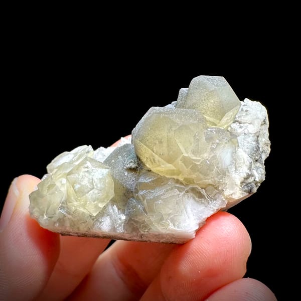 Pale yellow-green calcite rhombs with cream dolomite from Fujian, China, second angle