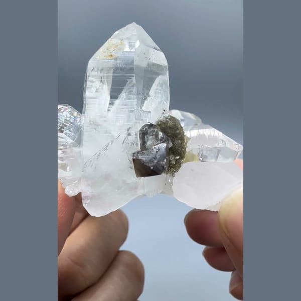 Clear Yaogangxian quartz cluster with scheelite, fluorite and mica — complete view