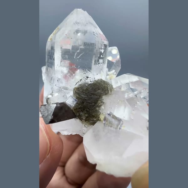 Clear Yaogangxian quartz cluster with scheelite, fluorite and mica — alternate view