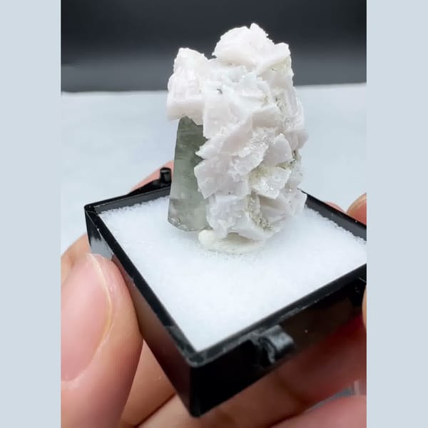 Green quartz crystal capped with white dolomite — alternate view