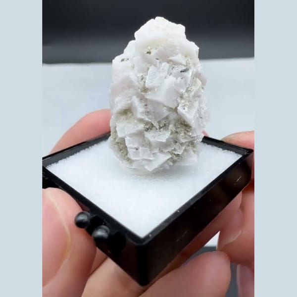 Green quartz crystal capped with white dolomite — alternate view