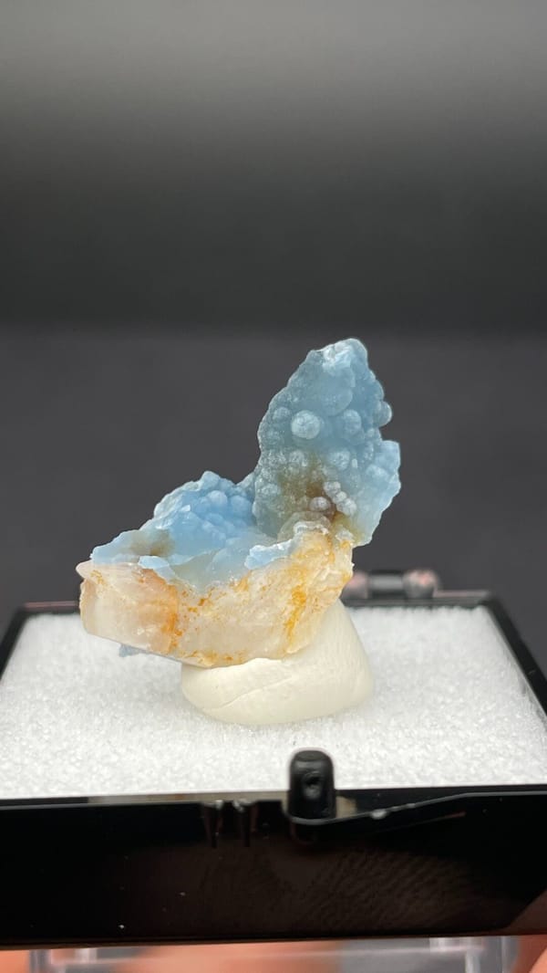 Sky-blue botryoidal plumbogummite on orange-tan matrix from Guangxi, China