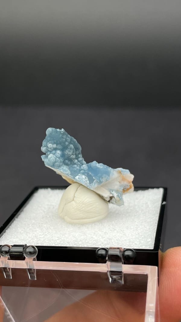 Sky-blue botryoidal plumbogummite on orange-tan matrix from Guangxi, China, top view