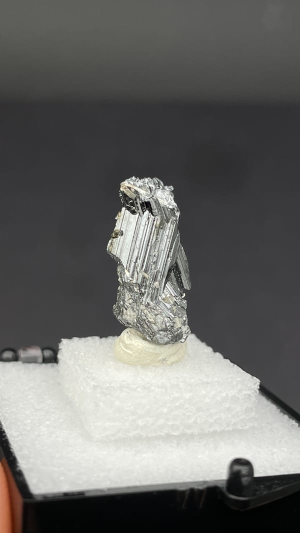 Silver cogwheel-twinned bournonite crystal from Yaogangxian, Hunan, China, close-up of the crystal faces
