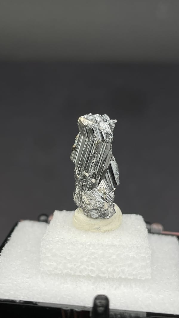 Silver cogwheel-twinned bournonite crystal from Yaogangxian, Hunan, China, reverse side