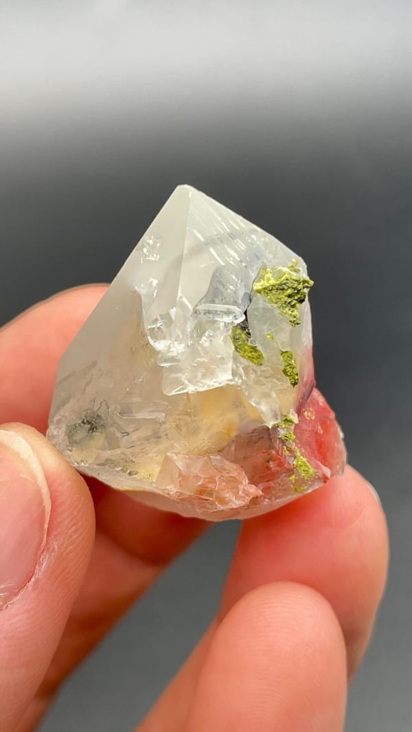 Clear quartz crystal with small green epidote inclusions from Meigu, Sichuan, second angle