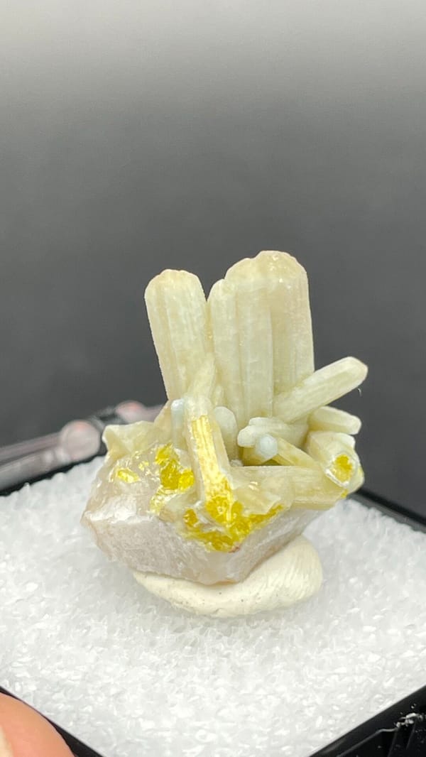 Cream-green plumbogummite prisms with yellow at the base, Guangxi, China, close-up of the crystal faces