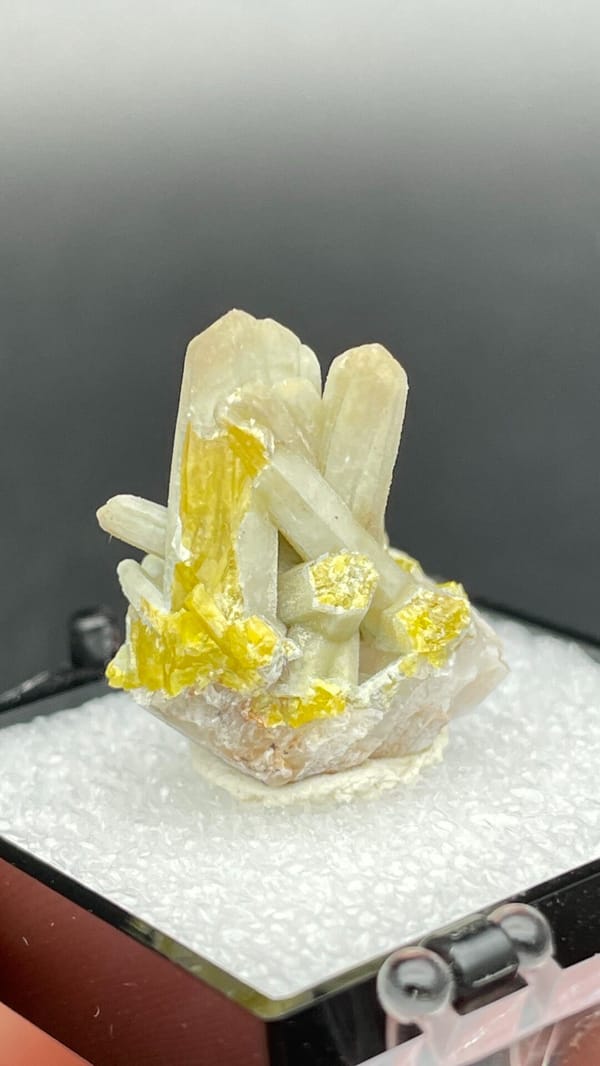 Cream-green plumbogummite prisms with yellow at the base, Guangxi, China, reverse side