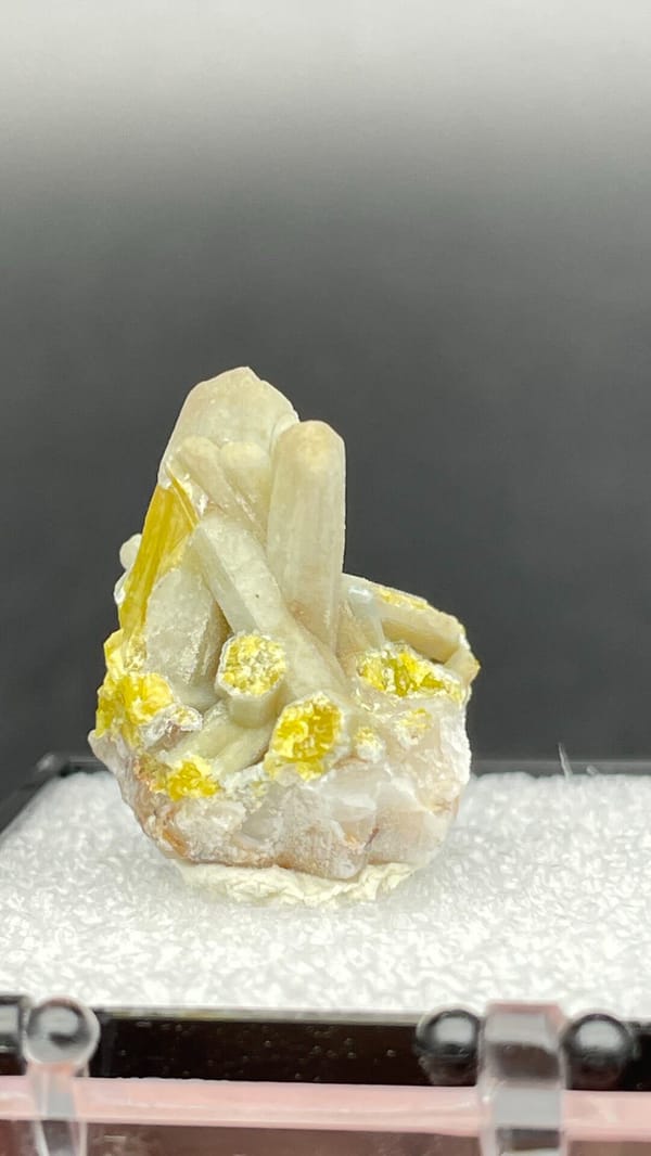 Cream-green plumbogummite prisms with yellow at the base, Guangxi, China, top view