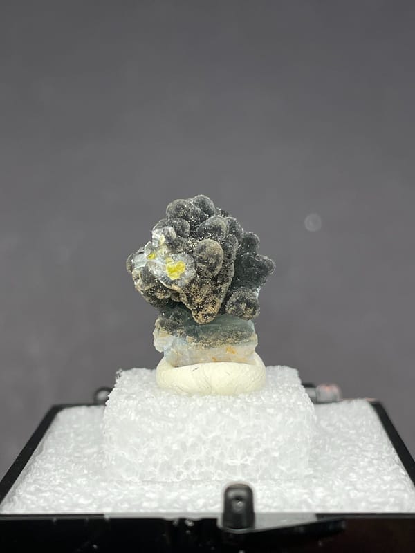 Grey-green botryoidal plumbogummite ball cluster from Guangxi, China, in a box, second angle