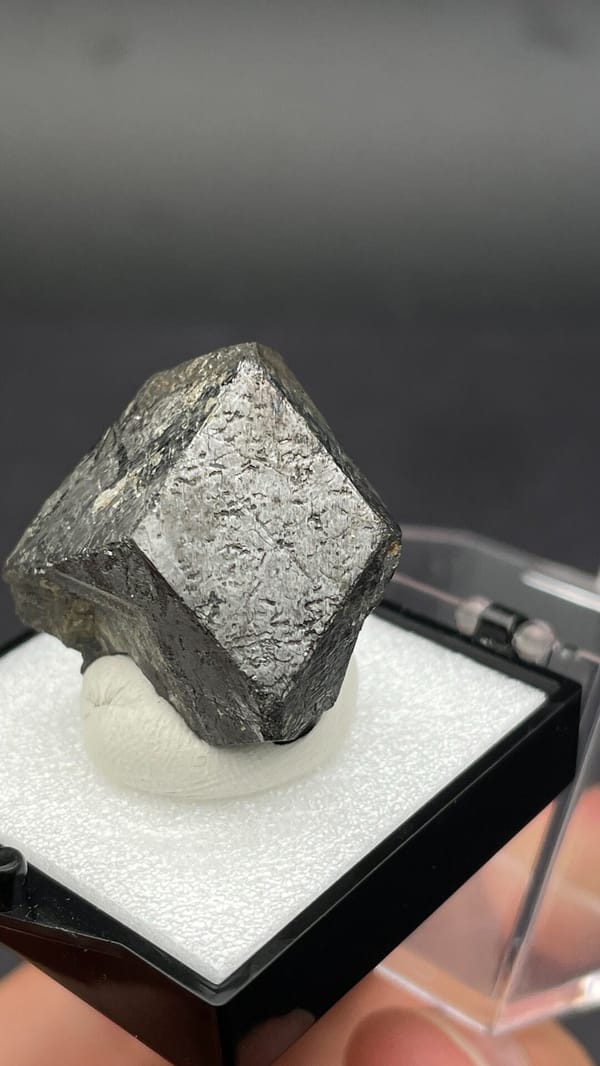 Dark steel-grey magnetite single crystal from Inner Mongolia, China, in a box, second angle