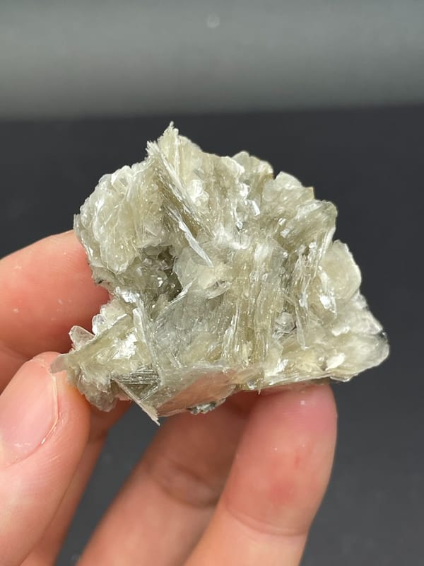 Silvery mica book cluster from Xuebaoding, Sichuan, China, close-up of the crystal faces