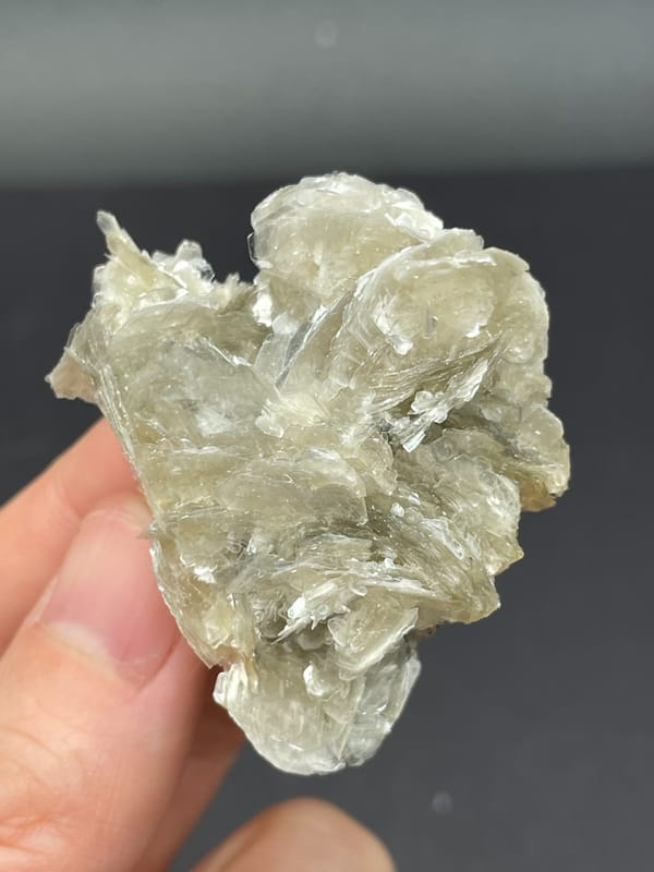 Silvery mica book cluster from Xuebaoding, Sichuan, China, reverse side
