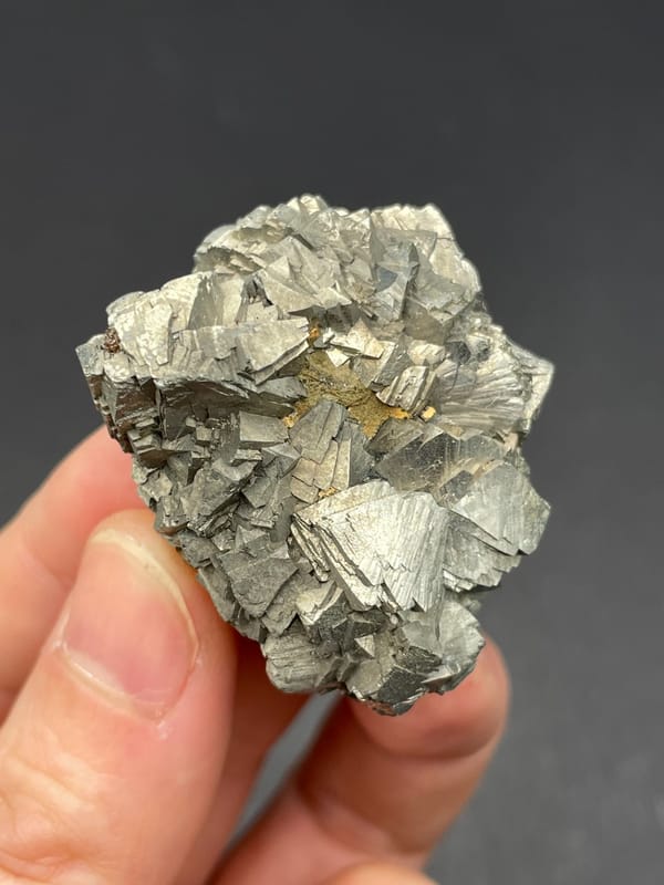 Silvery metallic arsenopyrite crystal group from Yaogangxian, Hunan, China, close-up of the crystal faces
