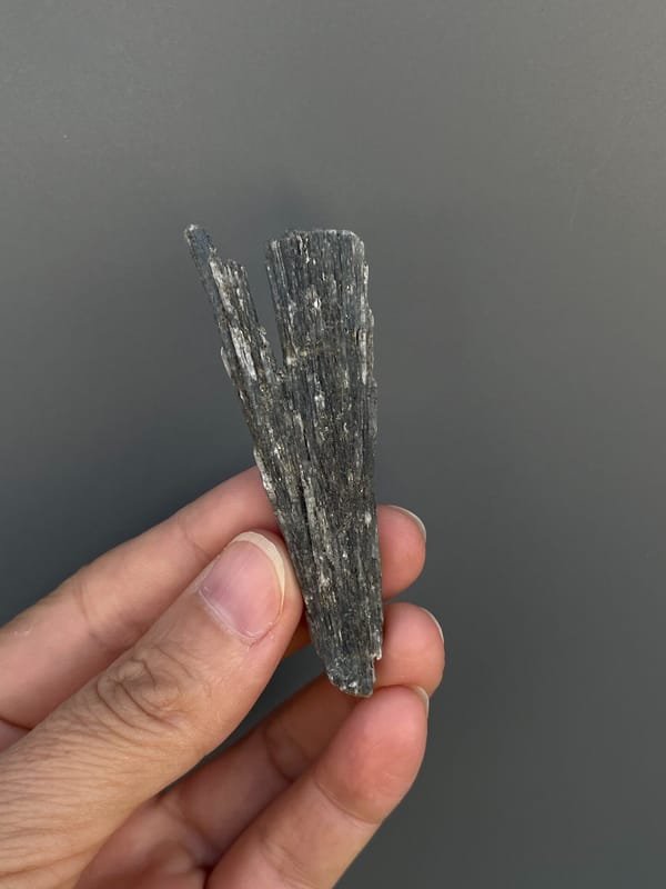 Steel blue-grey bladed kyanite crystal from Madagascar, close-up of the crystal faces