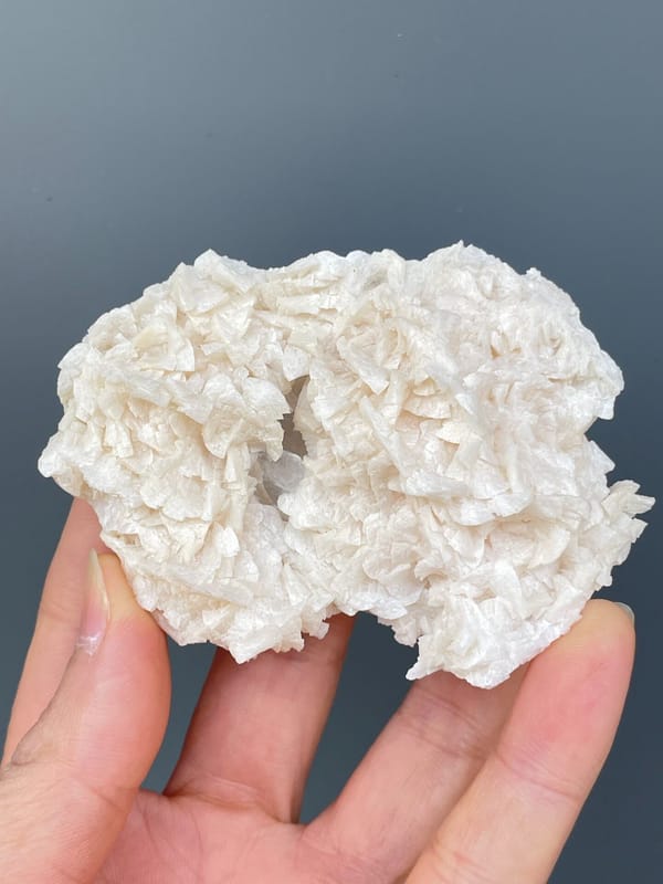 Plate covered in white platy dolomite rosettes from Hunan, China