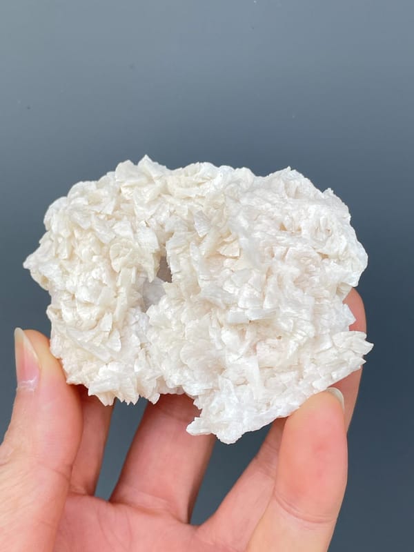 Plate covered in white platy dolomite rosettes from Hunan, China, reverse side