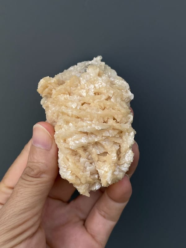 Cream-white dolomite crystal mass from Hunan, China, close-up of the crystal faces