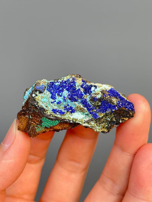 Electric blue azurite with green staining and pale gibbsite, Yunnan, China, reverse side