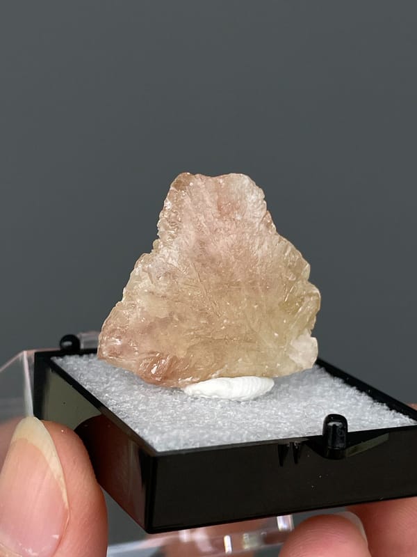 Translucent pale peach cerussite crystal from Gongcheng, Guangxi, China, close-up of the crystal faces