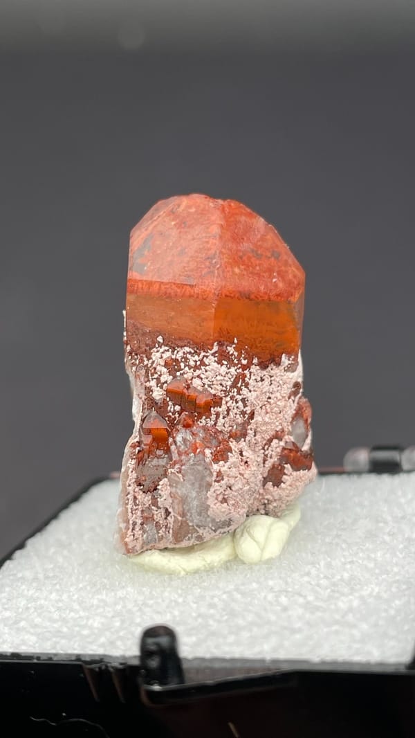 Deep red hematoid quartz crystal with frosted base from Shanxi, China, in a box
