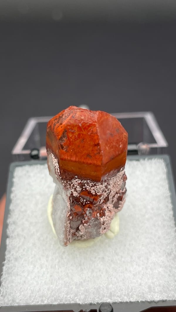 Deep red hematoid quartz crystal with frosted base from Shanxi, China, in a box, second angle