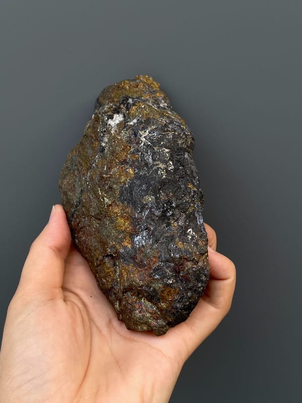 Large iridescent bronze and violet chalcopyrite mass from Hubei, China, top view