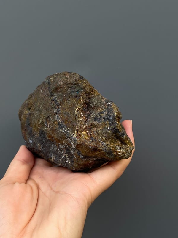 Large iridescent bronze and violet chalcopyrite mass from Hubei, China, side view