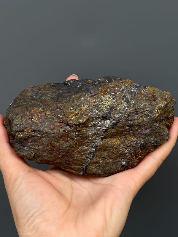 Large iridescent bronze and violet chalcopyrite mass from Hubei, China, close-up of terminations