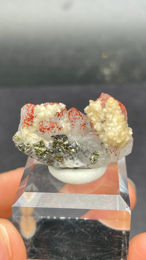 Red-spotted quartz with cream dolomite and brassy pyrite from Jiangxi, China, detail of the matrix contact
