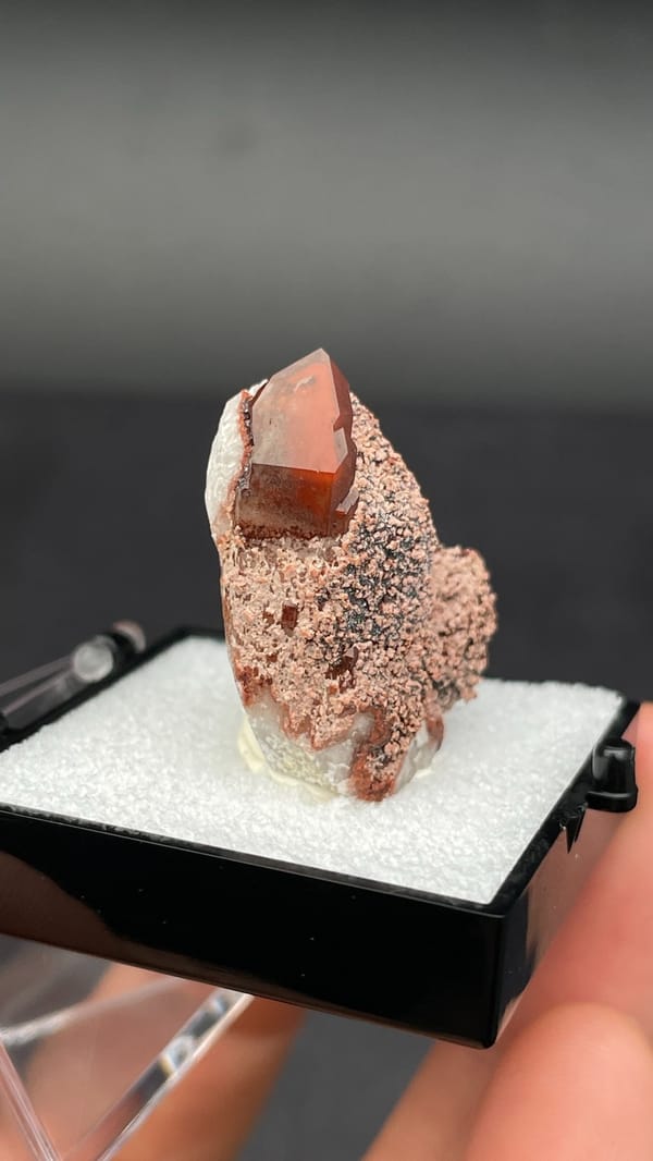 Dusty red hematoid quartz with black specular hematite flecks, Shanxi, China, top view