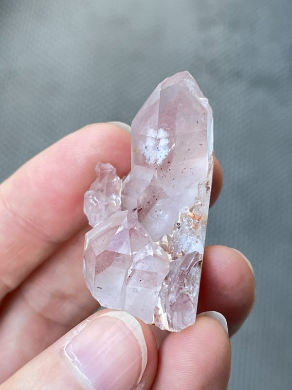 Rose-tinted quartz point group from India, reverse side