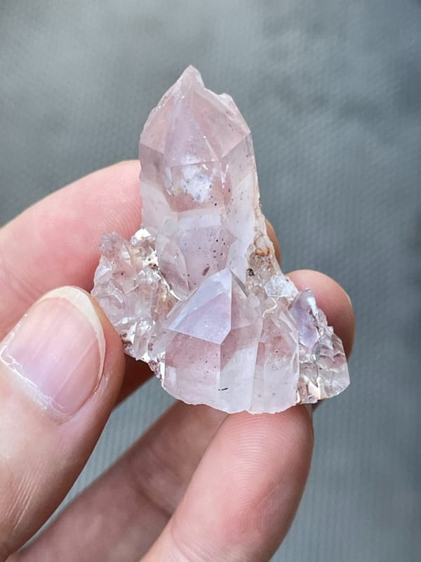 Rose-tinted quartz point group from India, top view