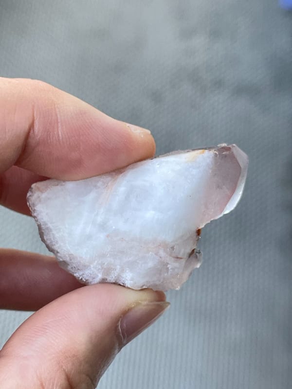Rose-tinted quartz point group from India, detail of the matrix contact