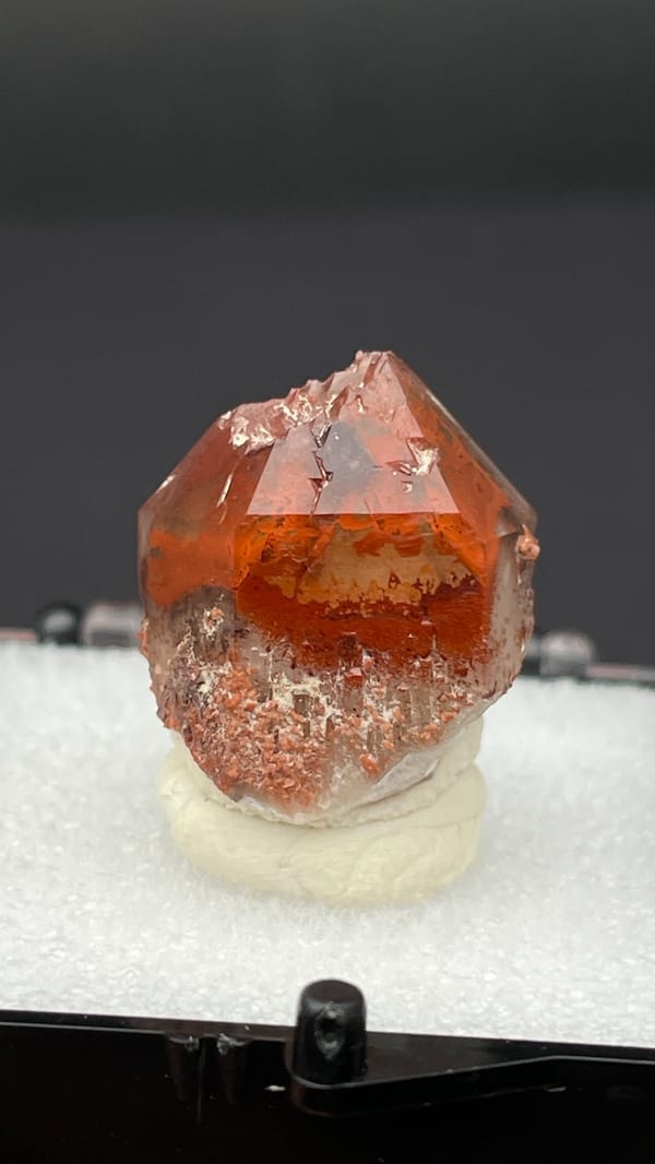 Orange-red hematoid quartz crystal with a clear amber tip from Shanxi, China