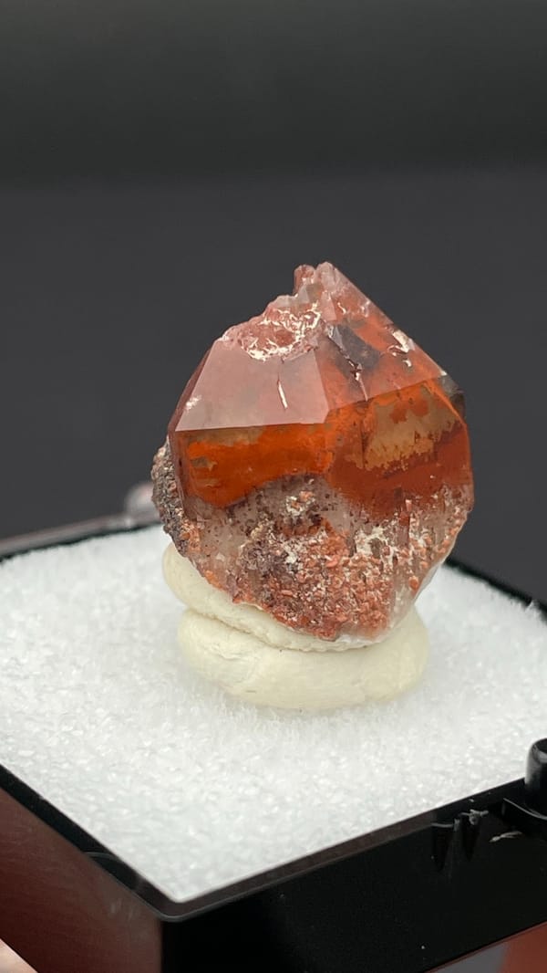 Orange-red hematoid quartz crystal with a clear amber tip from Shanxi, China, second angle