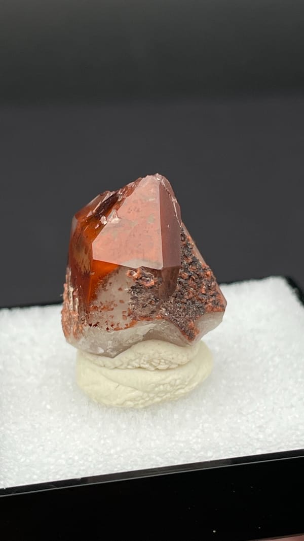 Orange-red hematoid quartz crystal with a clear amber tip from Shanxi, China, reverse side