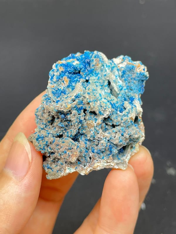 Strong blue veszelyite crust over pale rock from Yunnan, China, second angle