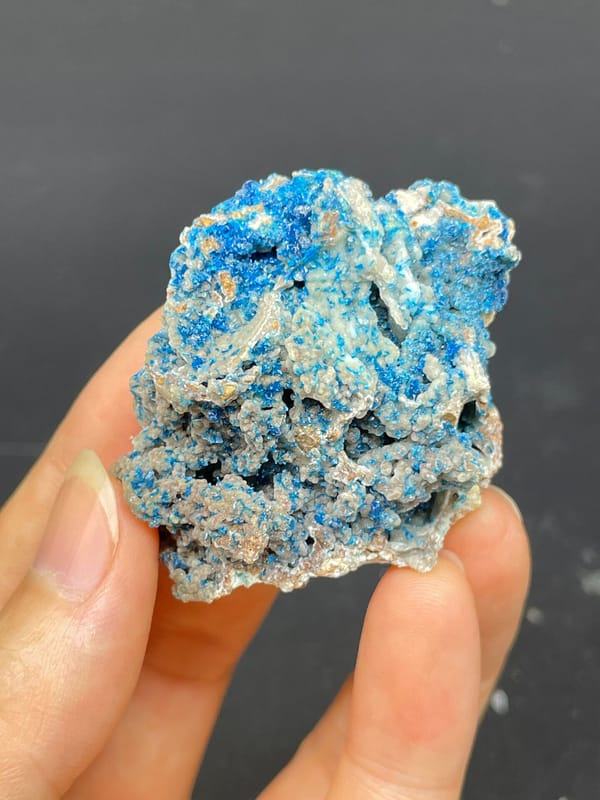 Strong blue veszelyite crust over pale rock from Yunnan, China, reverse side