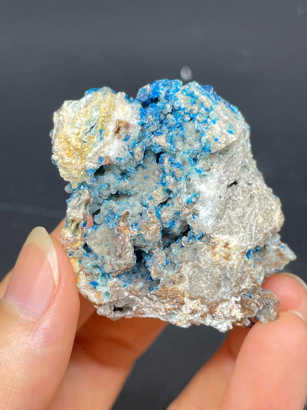 Strong blue veszelyite crust over pale rock from Yunnan, China, top view