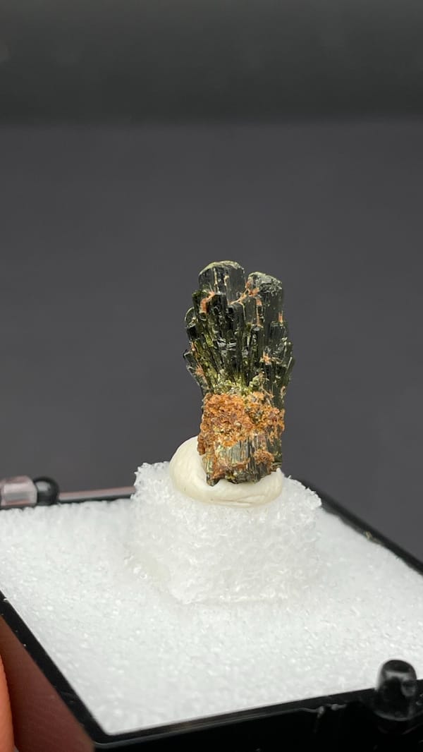 Small fan of olive-green epidote blades on orange base, Handan, Hebei, China, second angle