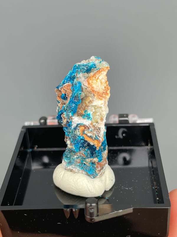 Tall piece with blue veszelyite and orange banding from Yunnan, China