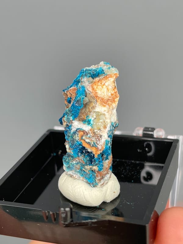 Tall piece with blue veszelyite and orange banding from Yunnan, China, close-up of the crystal faces