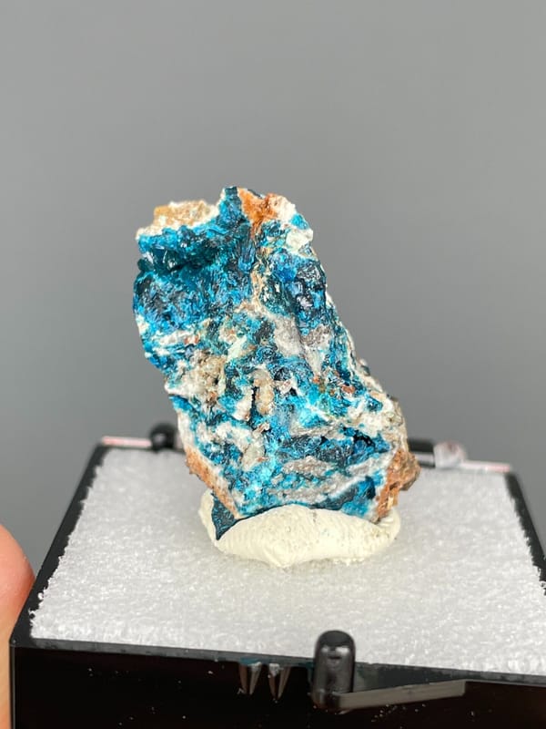 Upright piece fully crusted with blue veszelyite from Yunnan, China, in a box