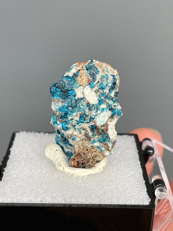 Upright piece fully crusted with blue veszelyite from Yunnan, China, in a box, close-up of the crystal faces