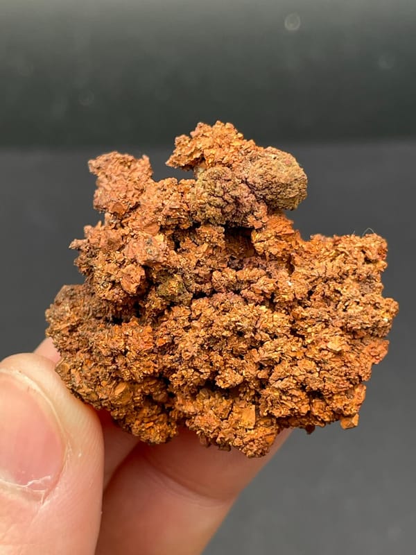 Spongy branching native copper mass from Hubei, China, held in hand