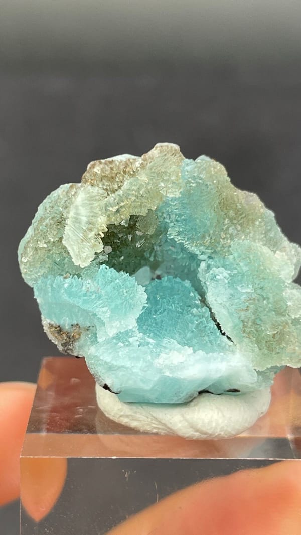Mint-turquoise botryoidal hemimorphite around a hollow, Guangdong, China