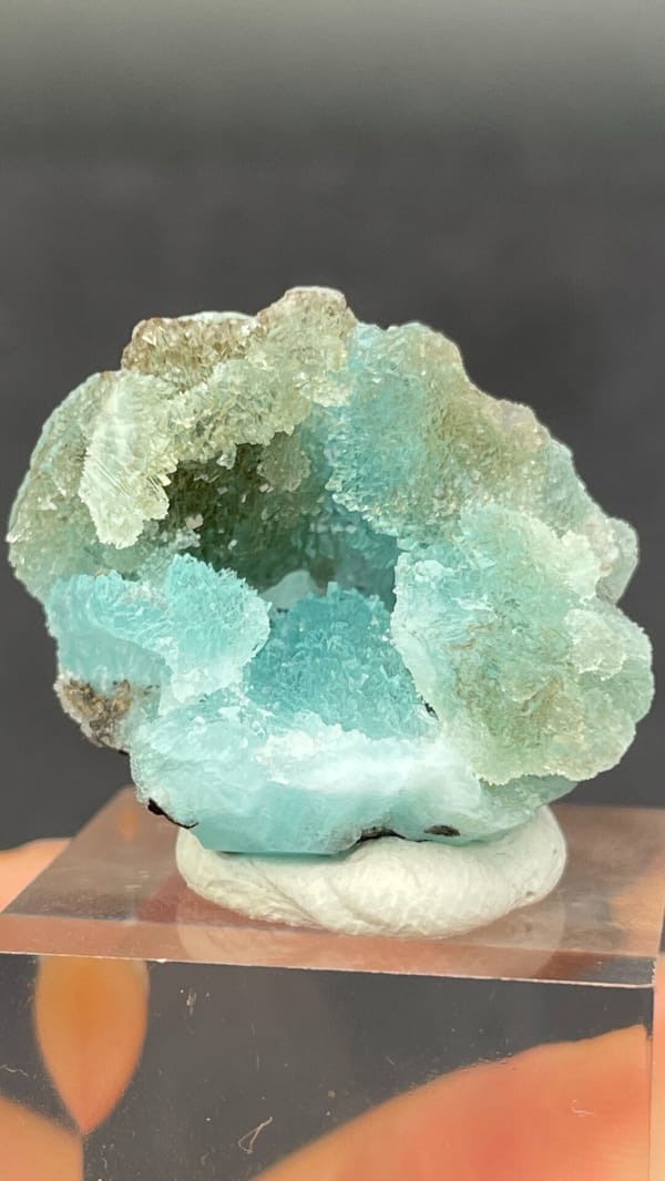 Mint-turquoise botryoidal hemimorphite around a hollow, Guangdong, China, second angle