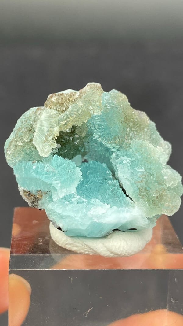 Mint-turquoise botryoidal hemimorphite around a hollow, Guangdong, China, reverse side