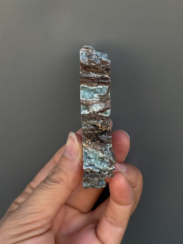 Pale blue-green hemimorphite lining an open skeletal rock, Yunnan, China, second angle